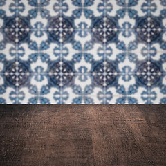 Image showing Wood table top and blur vintage ceramic tile pattern wall