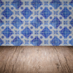 Image showing Wood table top and blur vintage ceramic tile pattern wall