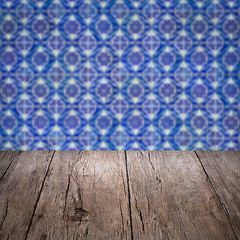 Image showing Wood table top and blur vintage ceramic tile pattern wall