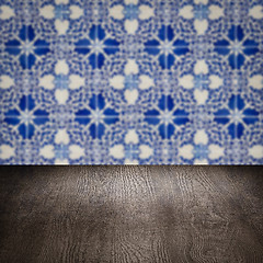 Image showing Wood table top and blur vintage ceramic tile pattern wall