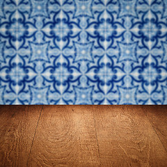 Image showing Wood table top and blur vintage ceramic tile pattern wall