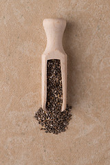 Image showing Wooden scoop with chia seeds