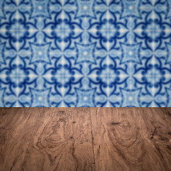 Image showing Wood table top and blur vintage ceramic tile pattern wall