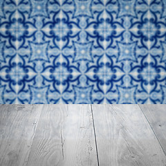 Image showing Wood table top and blur vintage ceramic tile pattern wall