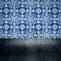 Image showing Wood table top and blur vintage ceramic tile pattern wall