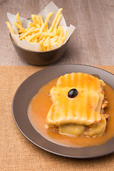 Image showing Francesinha and french fries