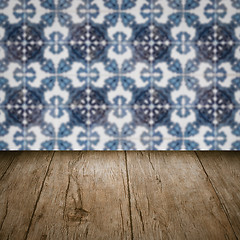 Image showing Wood table top and blur vintage ceramic tile pattern wall