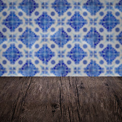 Image showing Wood table top and blur vintage ceramic tile pattern wall