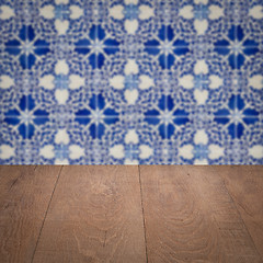 Image showing Wood table top and blur vintage ceramic tile pattern wall