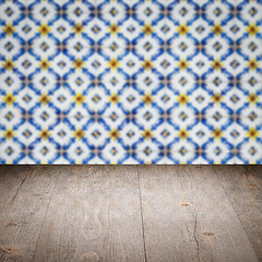 Image showing Wood table top and blur vintage ceramic tile pattern wall