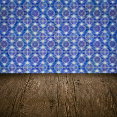 Image showing Wood table top and blur vintage ceramic tile pattern wall