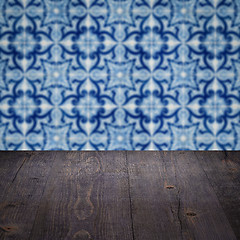 Image showing Wood table top and blur vintage ceramic tile pattern wall