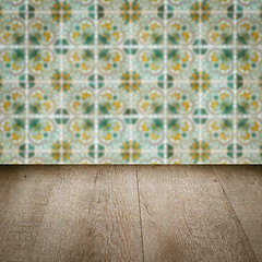 Image showing Wood table top and blur vintage ceramic tile pattern wall