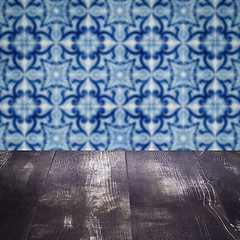 Image showing Wood table top and blur vintage ceramic tile pattern wall