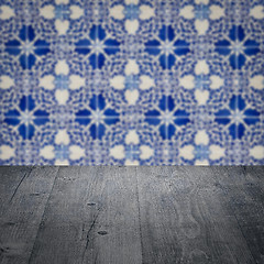 Image showing Wood table top and blur vintage ceramic tile pattern wall