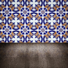 Image showing Wood table top and blur vintage ceramic tile pattern wall