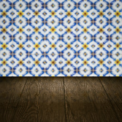 Image showing Wood table top and blur vintage ceramic tile pattern wall