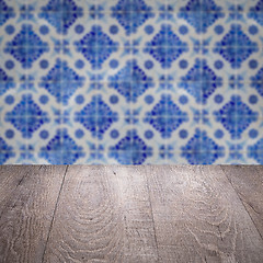 Image showing Wood table top and blur vintage ceramic tile pattern wall