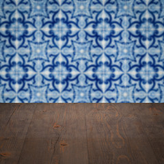 Image showing Wood table top and blur vintage ceramic tile pattern wall