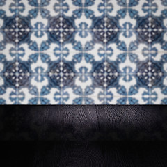 Image showing Wood table top and blur vintage ceramic tile pattern wall