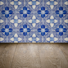 Image showing Wood table top and blur vintage ceramic tile pattern wall