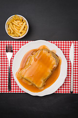 Image showing Francesinha and french fries