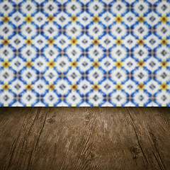 Image showing Wood table top and blur vintage ceramic tile pattern wall