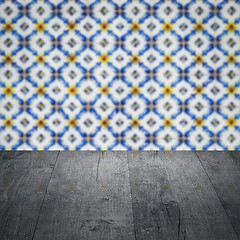 Image showing Wood table top and blur vintage ceramic tile pattern wall