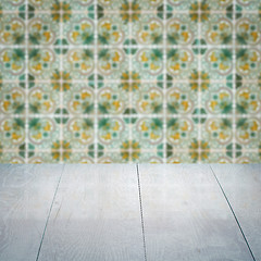 Image showing Wood table top and blur vintage ceramic tile pattern wall