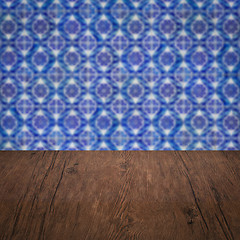 Image showing Wood table top and blur vintage ceramic tile pattern wall