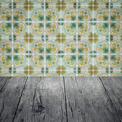 Image showing Wood table top and blur vintage ceramic tile pattern wall