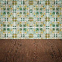 Image showing Wood table top and blur vintage ceramic tile pattern wall