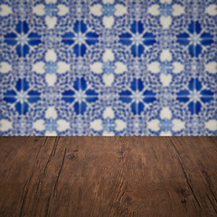 Image showing Wood table top and blur vintage ceramic tile pattern wall