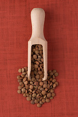 Image showing Wooden scoop with lentils