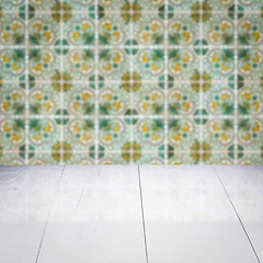 Image showing Wood table top and blur vintage ceramic tile pattern wall