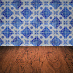 Image showing Wood table top and blur vintage ceramic tile pattern wall