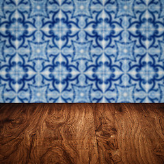 Image showing Wood table top and blur vintage ceramic tile pattern wall