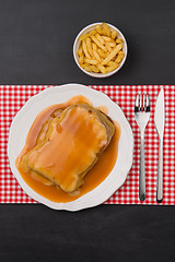 Image showing Francesinha and french fries