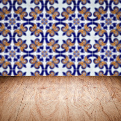 Image showing Wood table top and blur vintage ceramic tile pattern wall