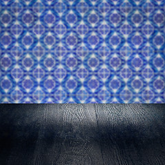 Image showing Wood table top and blur vintage ceramic tile pattern wall