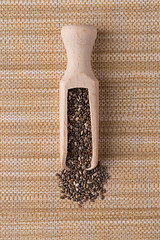 Image showing Wooden scoop with chia seeds