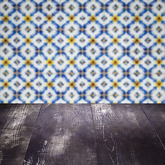 Image showing Wood table top and blur vintage ceramic tile pattern wall