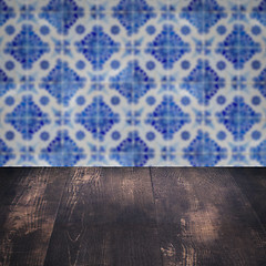 Image showing Wood table top and blur vintage ceramic tile pattern wall