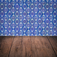 Image showing Wood table top and blur vintage ceramic tile pattern wall