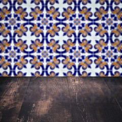 Image showing Wood table top and blur vintage ceramic tile pattern wall