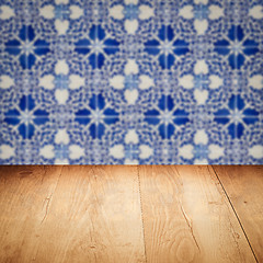 Image showing Wood table top and blur vintage ceramic tile pattern wall