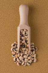 Image showing Wooden scoop with white beans