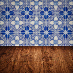 Image showing Wood table top and blur vintage ceramic tile pattern wall