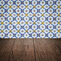 Image showing Wood table top and blur vintage ceramic tile pattern wall