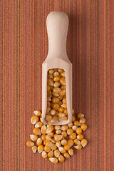 Image showing Wooden scoop with corn